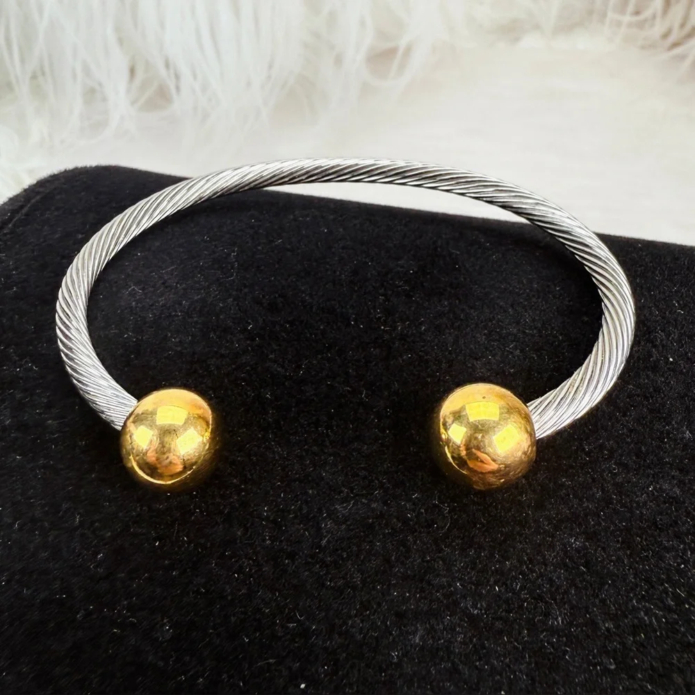 Pretty silvertone and goldtone, twisted cuff bracelet